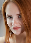 Stunning freckled redhead spreads her legs