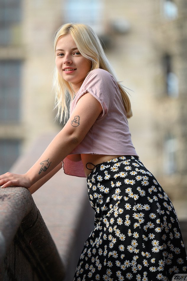 Look under Bianca Bell's shirt to see her big boobs at Zishy