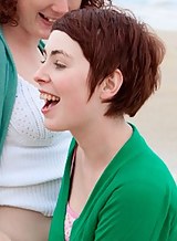 Redhead lesbians licking and fingering each others hairy pussy